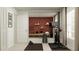 Well-equipped home gym features exercise equipment, weights, a full-length mirror, and a motivational art print at 10270 Purple Leaf Ct, Riverview, FL 33578