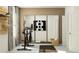 Bright exercise room with fitness equipment, mirrored wall, and storage for accessories at 11114 E 65Th Ter, Palmetto, FL 34221