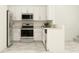 Bright kitchen features stainless steel appliances, white cabinets, and neutral countertops at 11114 E 65Th Ter, Palmetto, FL 34221