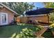 Backyard with green turf, tropical landscaping, and cozy seating areas, ideal for outdoor entertainment at 1174 8Th N St, St Petersburg, FL 33701