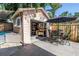 Backyard space with outdoor dining, garage access, stock tank pool, and shade sail provides outdoor activities at 1174 8Th N St, St Petersburg, FL 33701