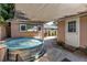 Backyard features a unique stock tank pool with an awning and chalkboard at 1174 8Th N St, St Petersburg, FL 33701