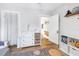 Calm Bedroom featuring a changing table, storage, and a rocking chair at 1174 8Th N St, St Petersburg, FL 33701