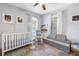 Bright bedroom featuring a crib, daybed, and colorful decor at 1174 8Th N St, St Petersburg, FL 33701