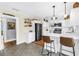 Bright, updated kitchen with white cabinets, stainless steel appliances, and barstool seating at 1174 8Th N St, St Petersburg, FL 33701