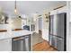 Open concept kitchen with stainless steel appliances and an inviting view into the living area at 1174 8Th N St, St Petersburg, FL 33701