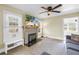 Bright living room with brick fireplace, built-in shelving, and large windows at 1174 8Th N St, St Petersburg, FL 33701