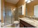 Bathroom features granite counter, cherry cabinet and glass enclosed tiled shower stall at 12352 Crestridge Loop, New Port Richey, FL 34655