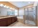 Bright bathroom features double vanity, soaking tub, and glass-enclosed shower at 12352 Crestridge Loop, New Port Richey, FL 34655