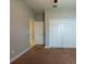 Neutral carpeted bedroom featuring a double door closet and an additional closet for ample storage at 12352 Crestridge Loop, New Port Richey, FL 34655