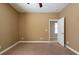 Bedroom with neutral wall paint, carpet floor, and open doorway leading to another room at 12352 Crestridge Loop, New Port Richey, FL 34655