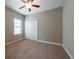 Bedroom featuring carpet floor, closet with sliding doors and single window with blinds at 12352 Crestridge Loop, New Port Richey, FL 34655