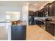 Kitchen featuring granite countertops, black appliances, and tile flooring at 12352 Crestridge Loop, New Port Richey, FL 34655