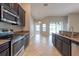 Kitchen featuring stainless steel appliances and granite countertops at 12352 Crestridge Loop, New Port Richey, FL 34655