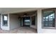 Covered patio with brick pavers, recessed lighting, ceiling fan and view of lake and neighboring homes at 12352 Crestridge Loop, New Port Richey, FL 34655