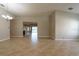 Open-concept living room with tile flooring, neutral walls, and abundant natural light at 12352 Crestridge Loop, New Port Richey, FL 34655