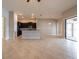 Open-concept living space with tile flooring and kitchen with island at 12352 Crestridge Loop, New Port Richey, FL 34655