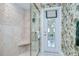 Shower with glass door, shower seat and door to the exterior at 124 Barrington Dr, Brandon, FL 33511
