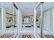Mirrored view of a luxurious bathroom with double vanity, soaking tub, and elegant design at 124 Barrington Dr, Brandon, FL 33511