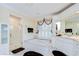Spa-like bathroom with soaking tub, walk-in shower, shuttered window, and white cabinetry at 124 Barrington Dr, Brandon, FL 33511