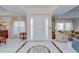 Elegant foyer featuring marble floors, a decorative ceiling, a front door, and bright sidelights at 124 Barrington Dr, Brandon, FL 33511