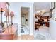 Hallway with wood floors leads to an office with custom built-in desk at 124 Barrington Dr, Brandon, FL 33511