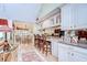 Open-concept kitchen and dining area with bar seating and elegant decor at 124 Barrington Dr, Brandon, FL 33511