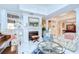 Elegant living room with fireplace, built-in bookshelves, marble floors, and comfortable seating at 124 Barrington Dr, Brandon, FL 33511