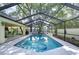 A pristine screened pool, complemented by lush landscaping and tranquil fountains, offers a private retreat at 124 Barrington Dr, Brandon, FL 33511