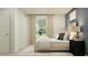 Bedroom with a comfortable bed, neutral tones, and a view through a bright window at 15038 Zircon Red Dr, Wimauma, FL 33598