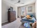 Cozy bedroom featuring neutral tones, a large dresser, and a comfortable bed at 1594 Cassius St, Lutz, FL 33549