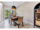 Dining room with a table, chairs, and slider doors leading to the outside area at 1594 Cassius St, Lutz, FL 33549