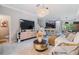 Bright, tiled living room with modern decor, an open layout, and contemporary furnishings at 1594 Cassius St, Lutz, FL 33549