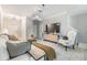 Bright, tiled living room with modern decor, an open layout, and contemporary furnishings at 1594 Cassius St, Lutz, FL 33549