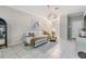 Bright, tiled living room with modern decor, an open layout, and contemporary furnishings at 1594 Cassius St, Lutz, FL 33549