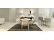 Elegant dining area featuring a wooden table, comfortable seating, and a stylish accent wall with a round mirror at 16983 Falling Waters Ct, Land O Lakes, FL 34638