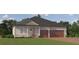 Charming single-story home with stone accents, a two-car garage, and a well-manicured lawn in a desirable community at 16983 Falling Waters Ct, Land O Lakes, FL 34638
