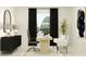 Bright and airy home office with a modern desk, comfortable seating, and stylish decor for a productive workspace at 16983 Falling Waters Ct, Land O Lakes, FL 34638