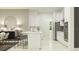 Well-lit kitchen features an island with seating and stainless steel appliances at 16983 Falling Waters Ct, Land O Lakes, FL 34638