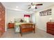 Bedroom with a wrought iron bed frame, wooden bench, and brick accent wall at 1722 48Th N Ave, St Petersburg, FL 33714