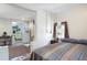 Bedroom featuring painted block walls next to a kitchenette with white appliances at 1722 48Th N Ave, St Petersburg, FL 33714