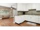 Well-lit kitchen features granite countertops, modern appliances, and seamless connectivity to the living area at 1722 48Th N Ave, St Petersburg, FL 33714