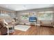 Bright and spacious living room with hardwood floors, natural light, and comfortable seating arrangements at 1722 48Th N Ave, St Petersburg, FL 33714