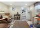 Living room featuring tile flooring, a dining table, and kitchenette access at 1722 48Th N Ave, St Petersburg, FL 33714