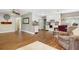 Open living space with white kitchen, dining area, and cozy living area featuring hardwood flooring at 1722 48Th N Ave, St Petersburg, FL 33714