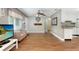 Bright living space with ceiling fan, hardwood floors, and easy access to other rooms at 1722 48Th N Ave, St Petersburg, FL 33714
