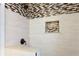 Shower with a built-in nook, mosaic tile accent, and rainfall shower head at 1722 48Th N Ave, St Petersburg, FL 33714