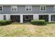 View of a backyard with a screened porch and manicured shrubs at 2140 Laceflower Dr, Brandon, FL 33510