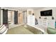 Spacious bedroom with wood sliding doors and a large dresser, offering ample storage and a stylish design at 2140 Laceflower Dr, Brandon, FL 33510