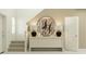 Hallway featuring modern console table, elegant decor, and a staircase to the upper level at 2274 Blue Grosbeak Pl, Wimauma, FL 33598